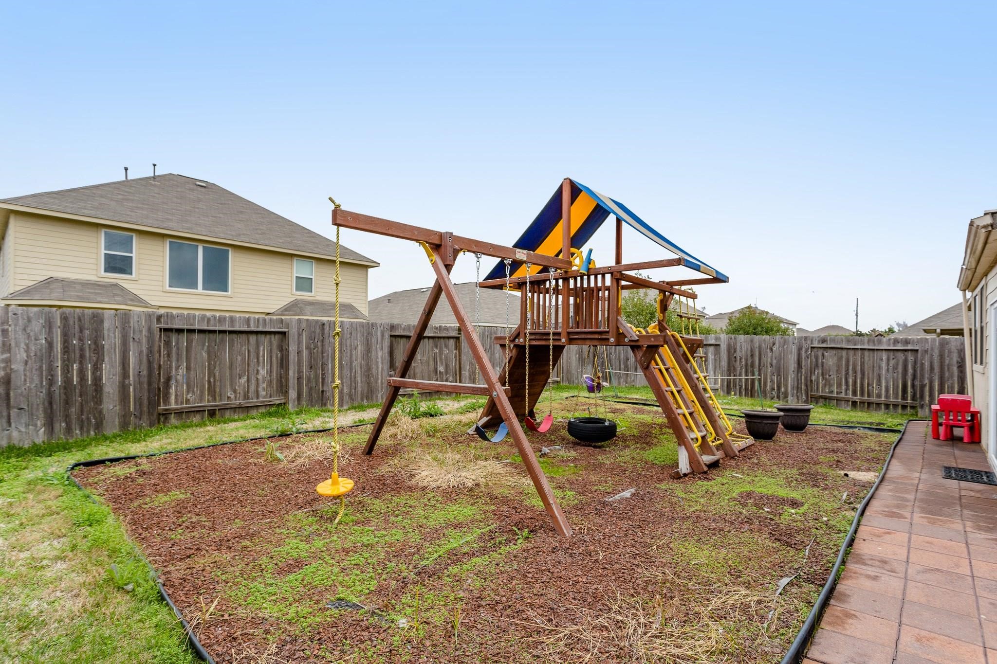3430 Lilac Ranch Drive Katy, TX 77494 - Photo 25 of 29 a view of a house with a park and a slide