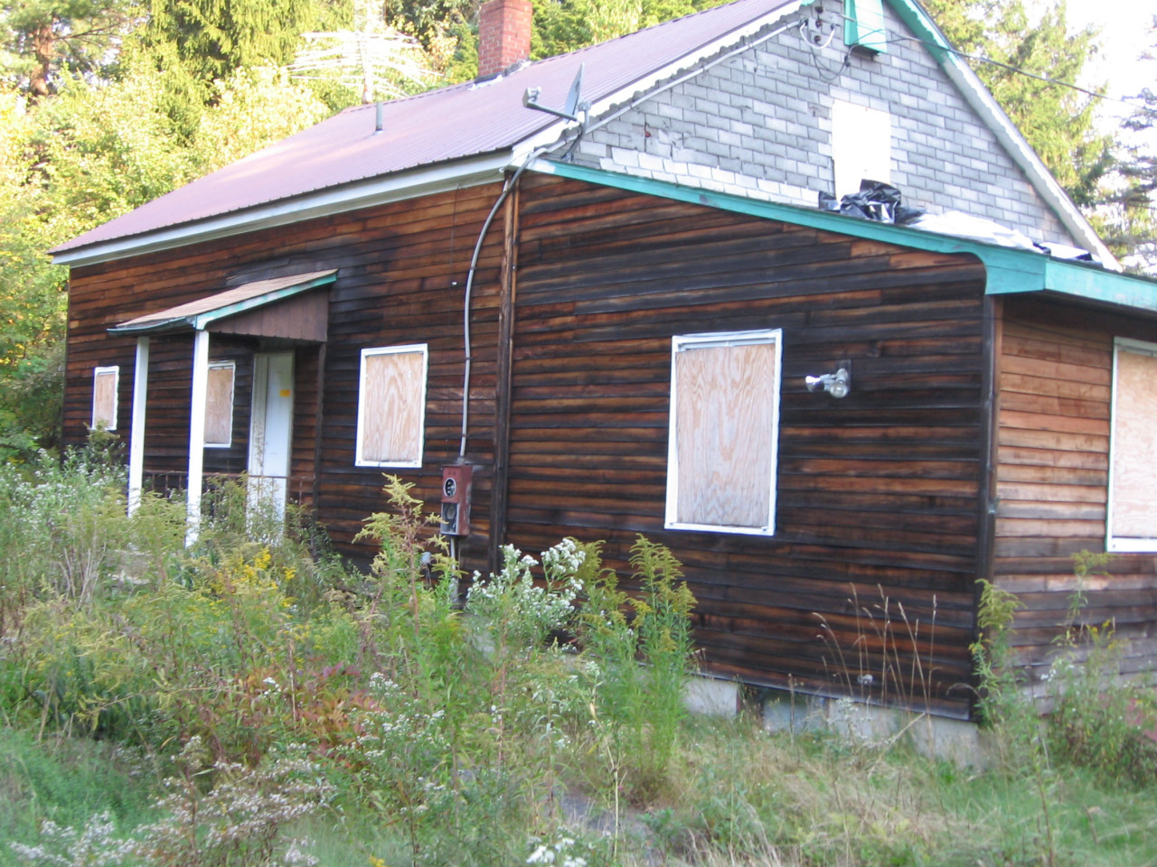 243 Sandisfield Road Sandisfield, MA 01255 - Photo 1 of 1 a front view of a house with a yard