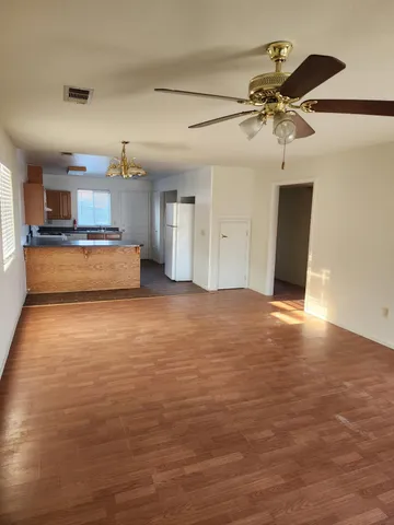a view of a livingroom with a kitchen