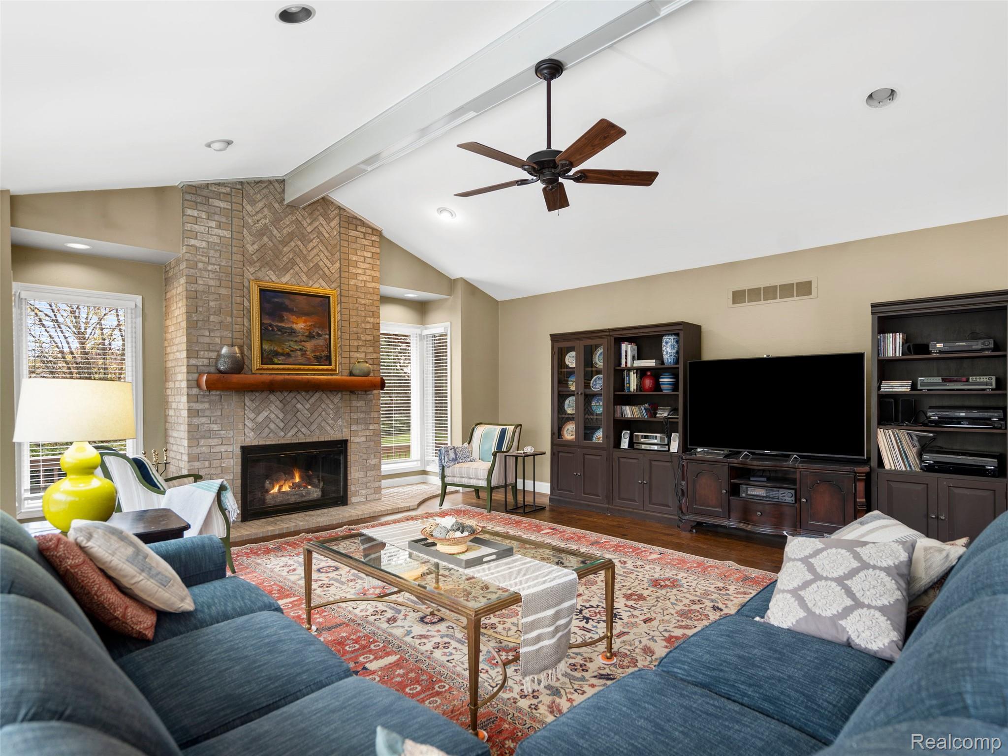 5724 Murfield Drive Rochester, MI 48306 - Photo 64 of 99 Living room featuring wood finished floors, a ceiling fan, a fireplace, and recessed lighting