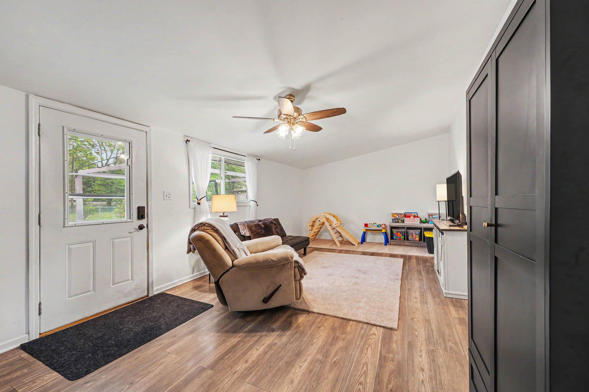 835 North Indiana Street Griffith, IN 46319 - Photo 11 of 19 a living room with furniture and a wooden floor