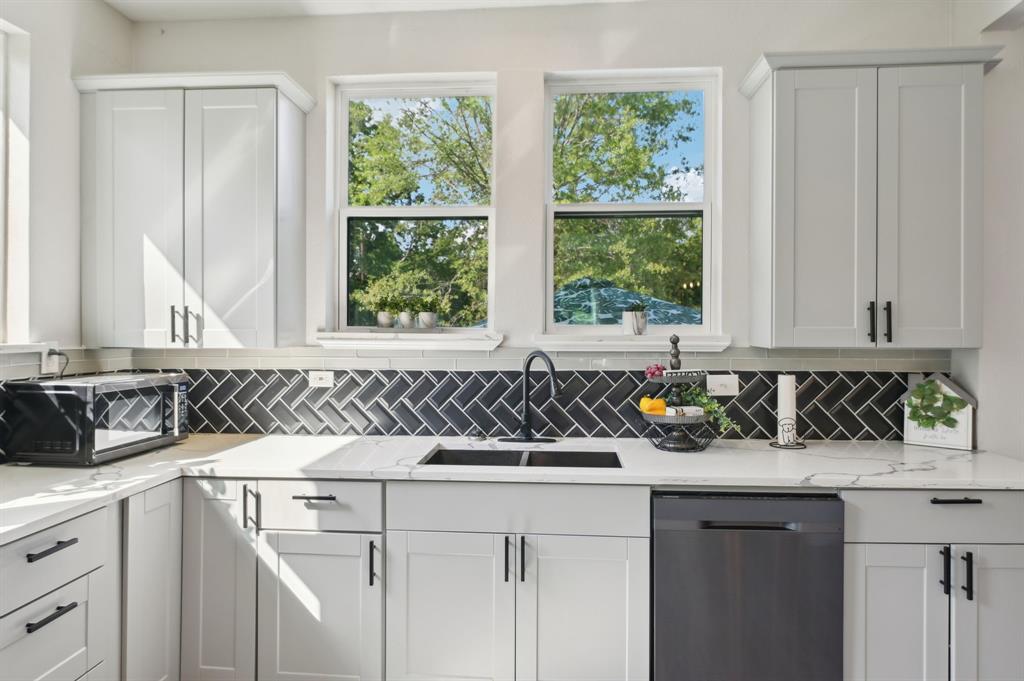 702 Griffith Avenue Terrell, TX 75160 - Photo 10 of 40 a kitchen with a sink and a window