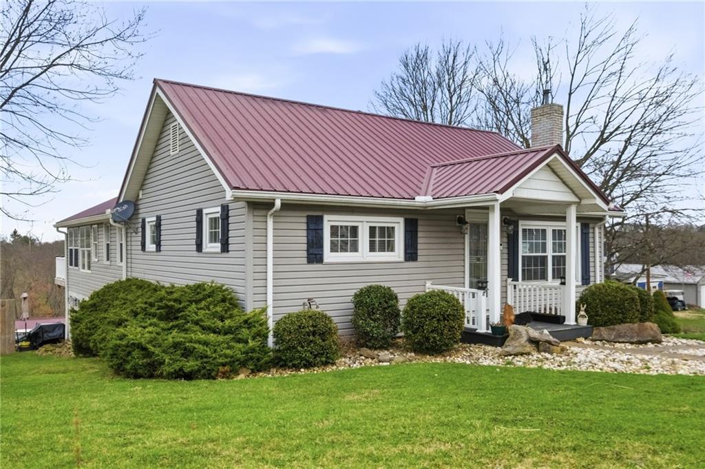 27 Bock Lane Baden, PA 15005 - Photo 4 of 50 a front view of a house with a garden