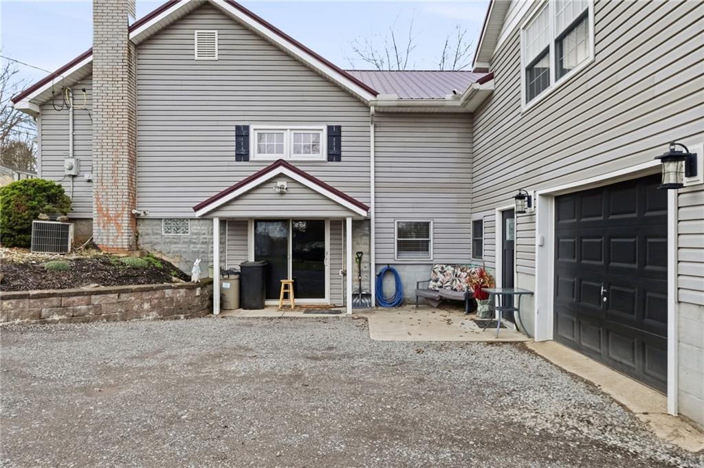 27 Bock Lane Baden, PA 15005 - Photo 5 of 50 a view of a house with a patio and a yard