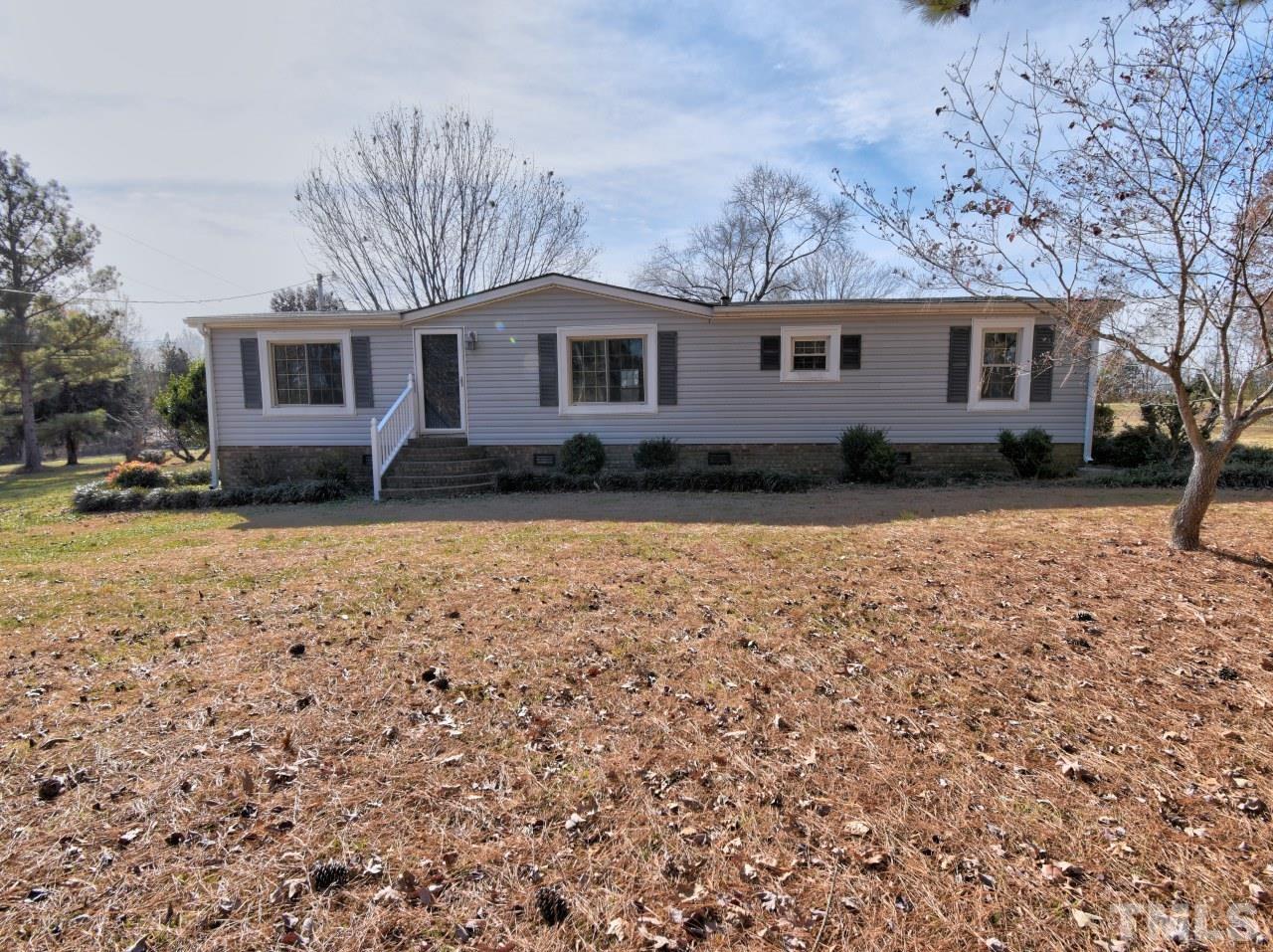 810 Dink Ashley Road Timberlake, NC 27583 - Photo 1 of 31 a view of a yard with a house