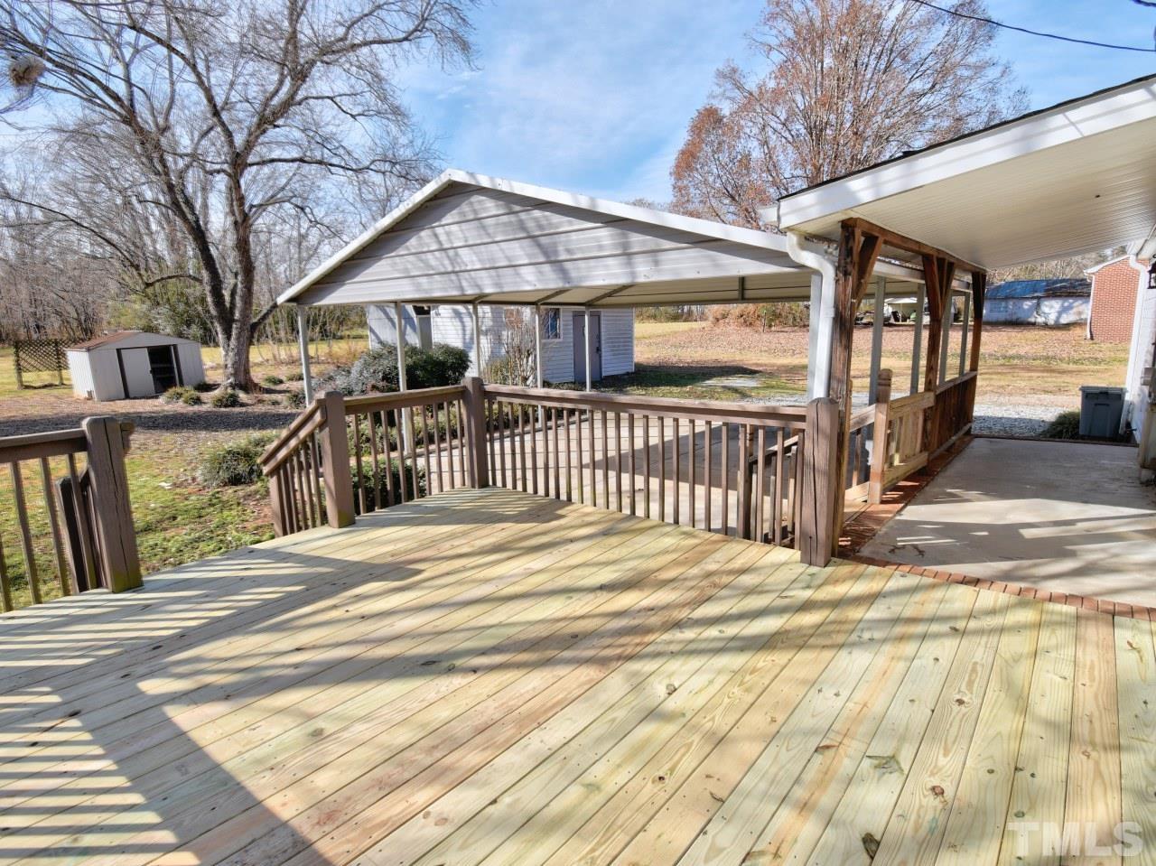 810 Dink Ashley Road Timberlake, NC 27583 - Photo 22 of 31 a view of a house with a iron gate