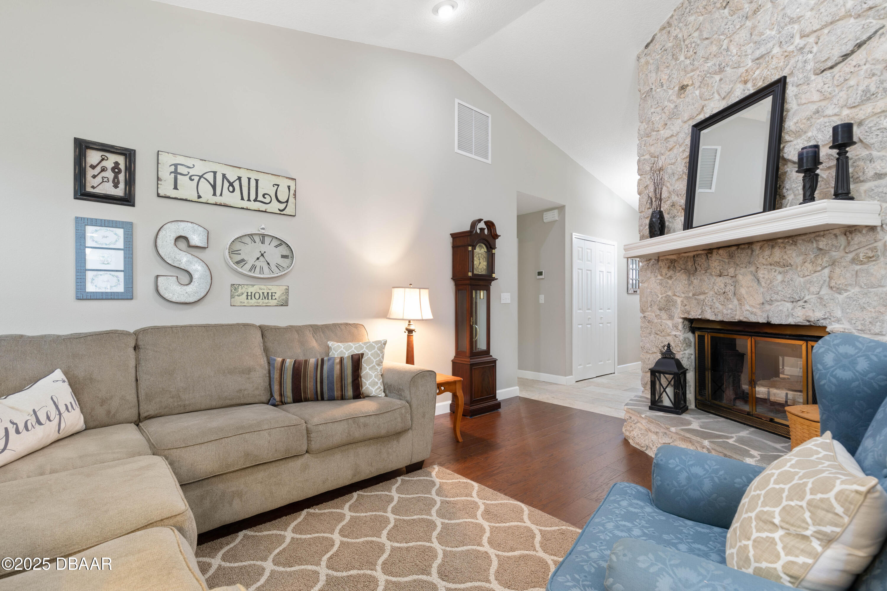 792 Victoria Circle East Ormond Beach, FL 32174 - Photo 12 of 53 a living room with furniture and a fireplace