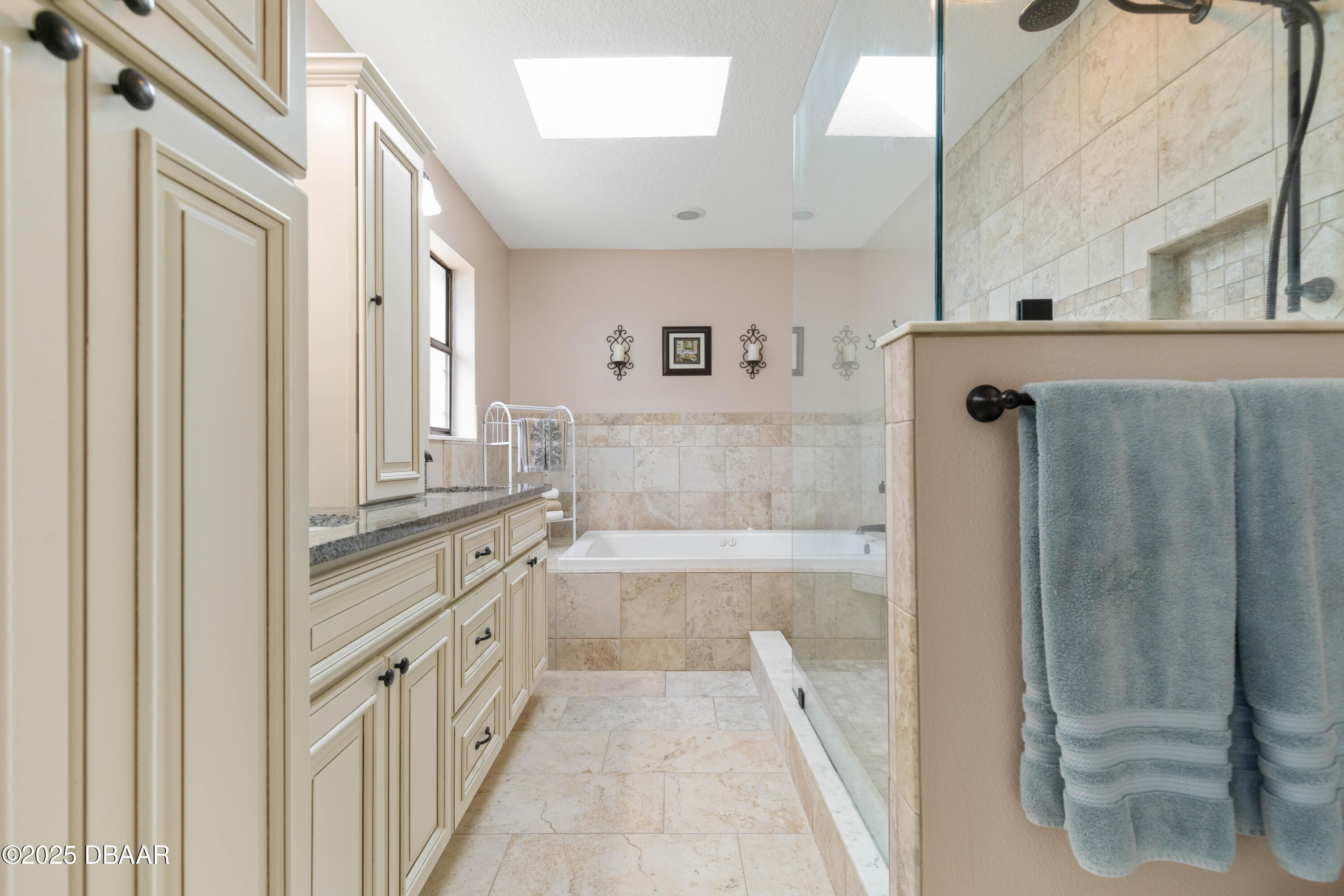 792 Victoria Circle East Ormond Beach, FL 32174 - Photo 23 of 53 a bathroom with a tub sink and mirror