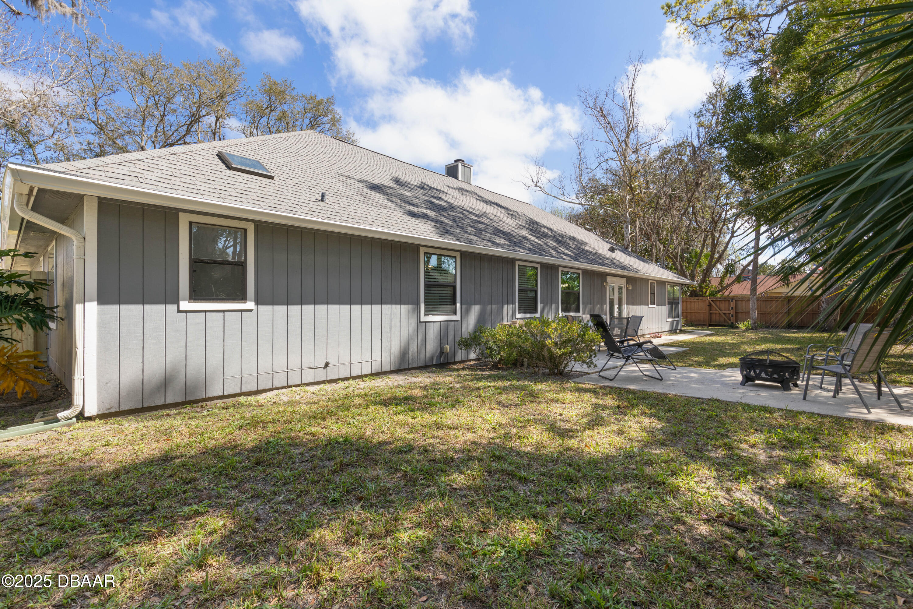 792 Victoria Circle East Ormond Beach, FL 32174 - Photo 40 of 53 a view of a house with a yard and large tree
