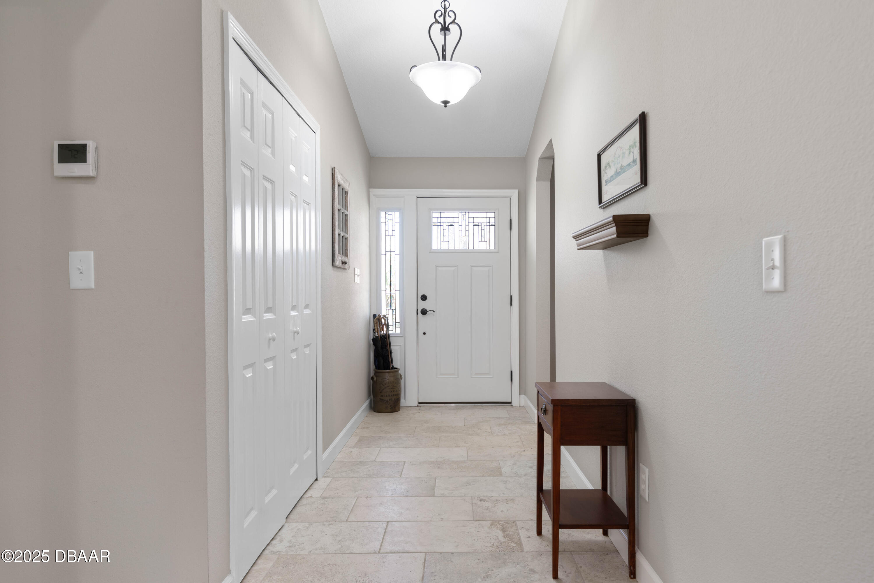 792 Victoria Circle East Ormond Beach, FL 32174 - Photo 4 of 53 a view of a hallway with entryway door