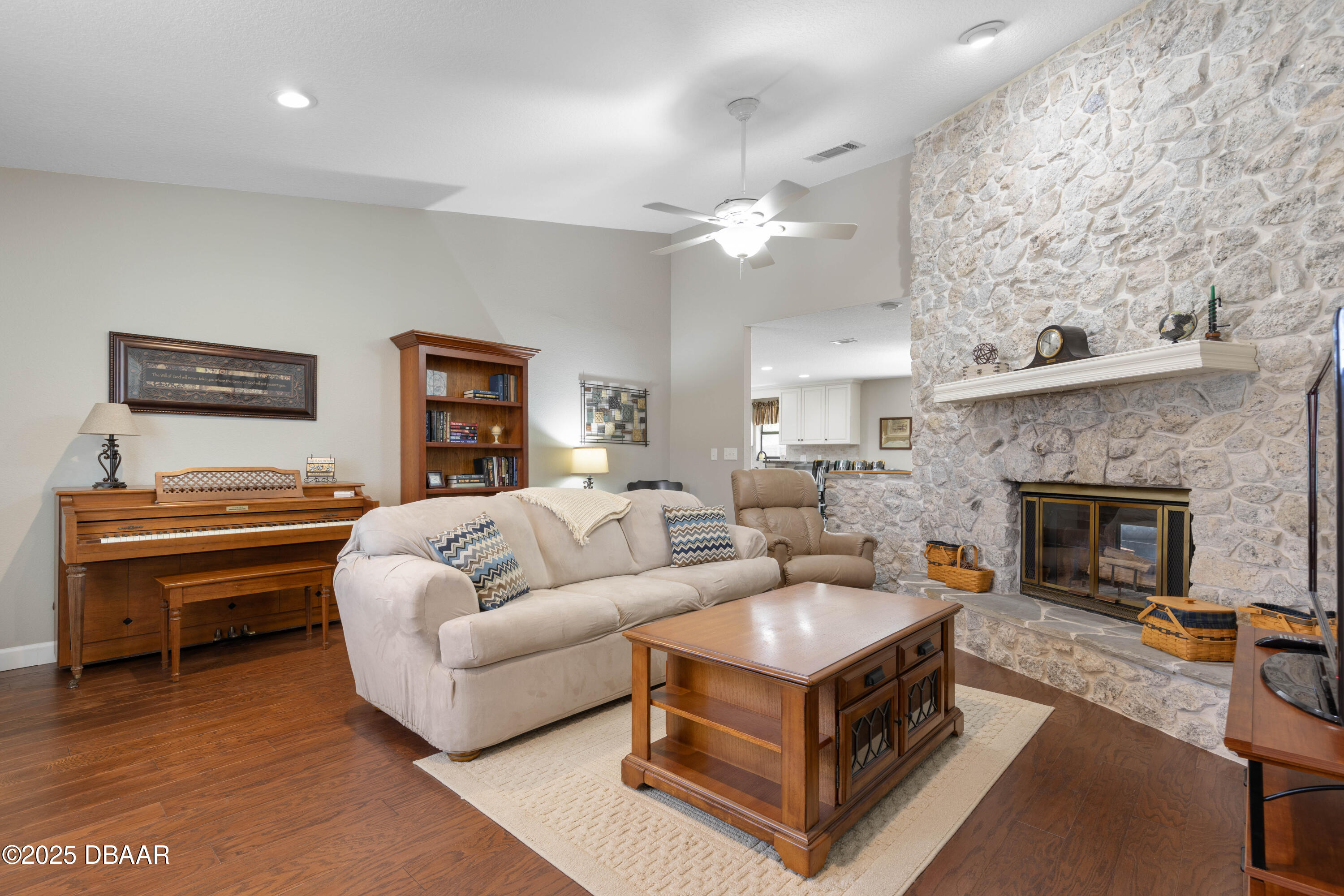 792 Victoria Circle East Ormond Beach, FL 32174 - Photo 6 of 53 a living room with furniture a fireplace and a piano