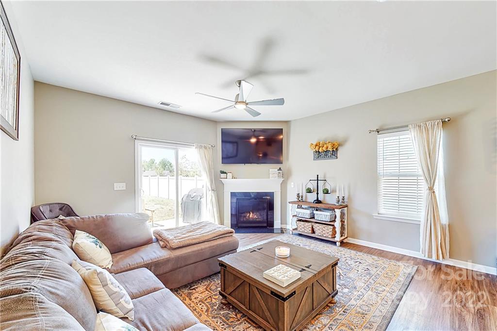 1016 Loggerhead Drive Lancaster, SC 29720 - Photo 12 of 46 a living room with furniture a fireplace and a flat screen tv