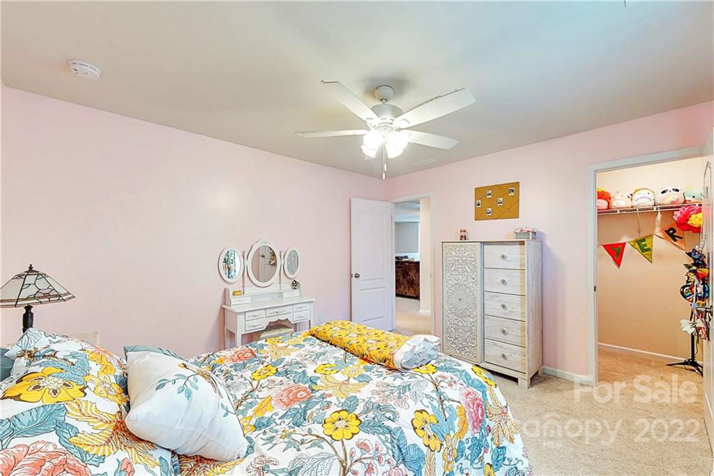 1016 Loggerhead Drive Lancaster, SC 29720 - Photo 25 of 46 a bedroom with a bed and painting on the wall