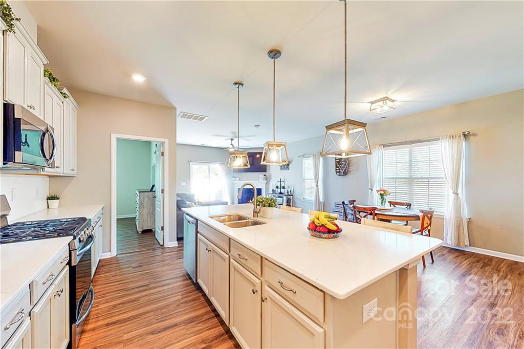 1016 Loggerhead Drive Lancaster, SC 29720 - Photo 6 of 46 a kitchen that has a lot of cabinets in it and wooden floors