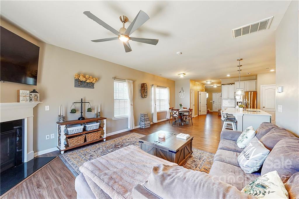 1016 Loggerhead Drive Lancaster, SC 29720 - Photo 10 of 46 a living room with furniture a flat screen tv and kitchen view