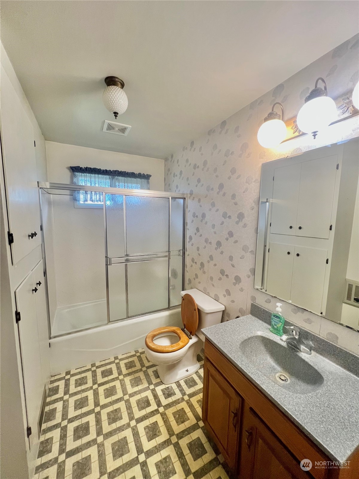 14 Weatherstone Road Omak, WA 98841 - Photo 24 of 32 a bathroom with a granite countertop sink toilet a mirror and shower