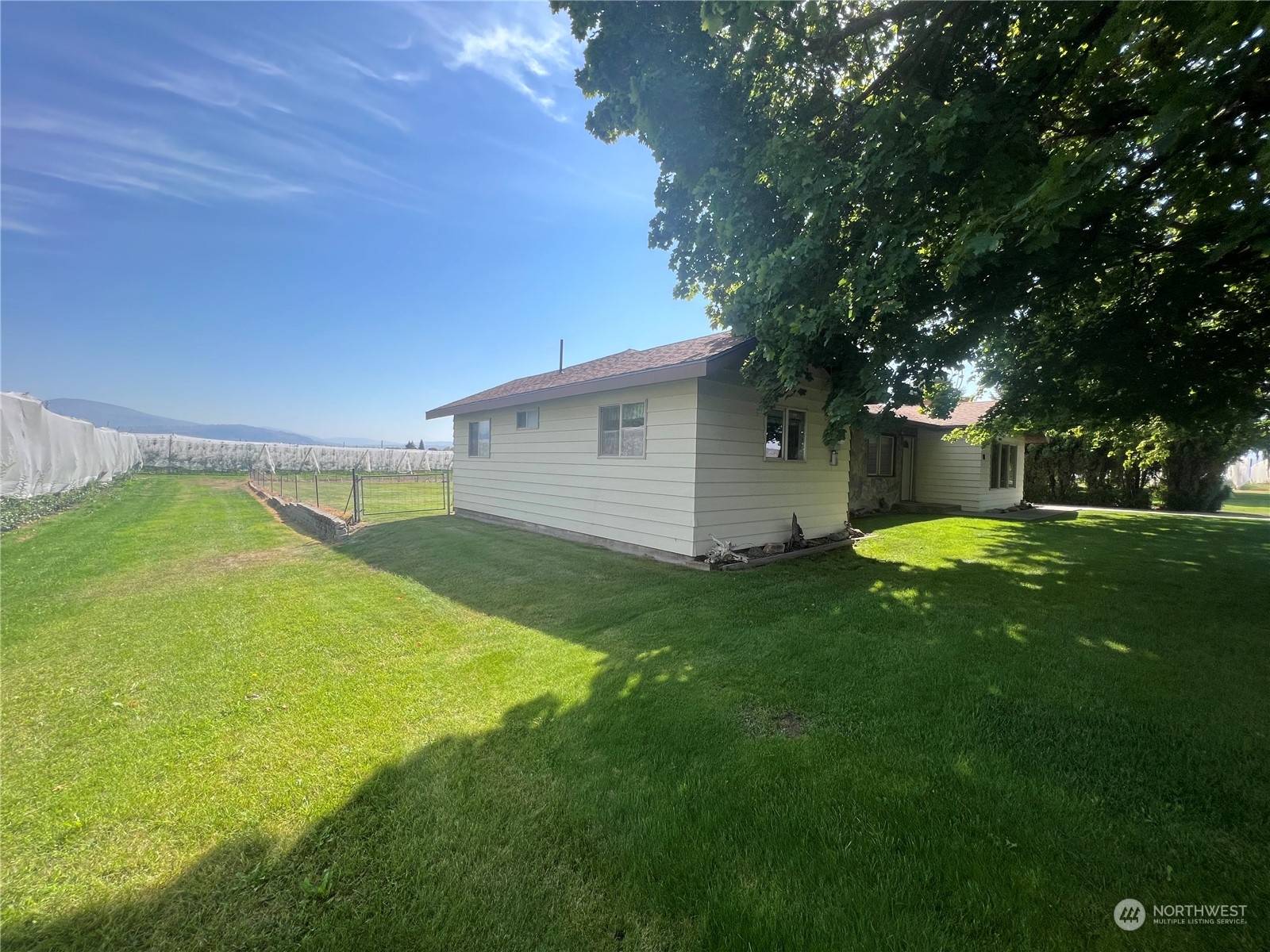 14 Weatherstone Road Omak, WA 98841 - Photo 3 of 32 a view of a backyard with swimming pool