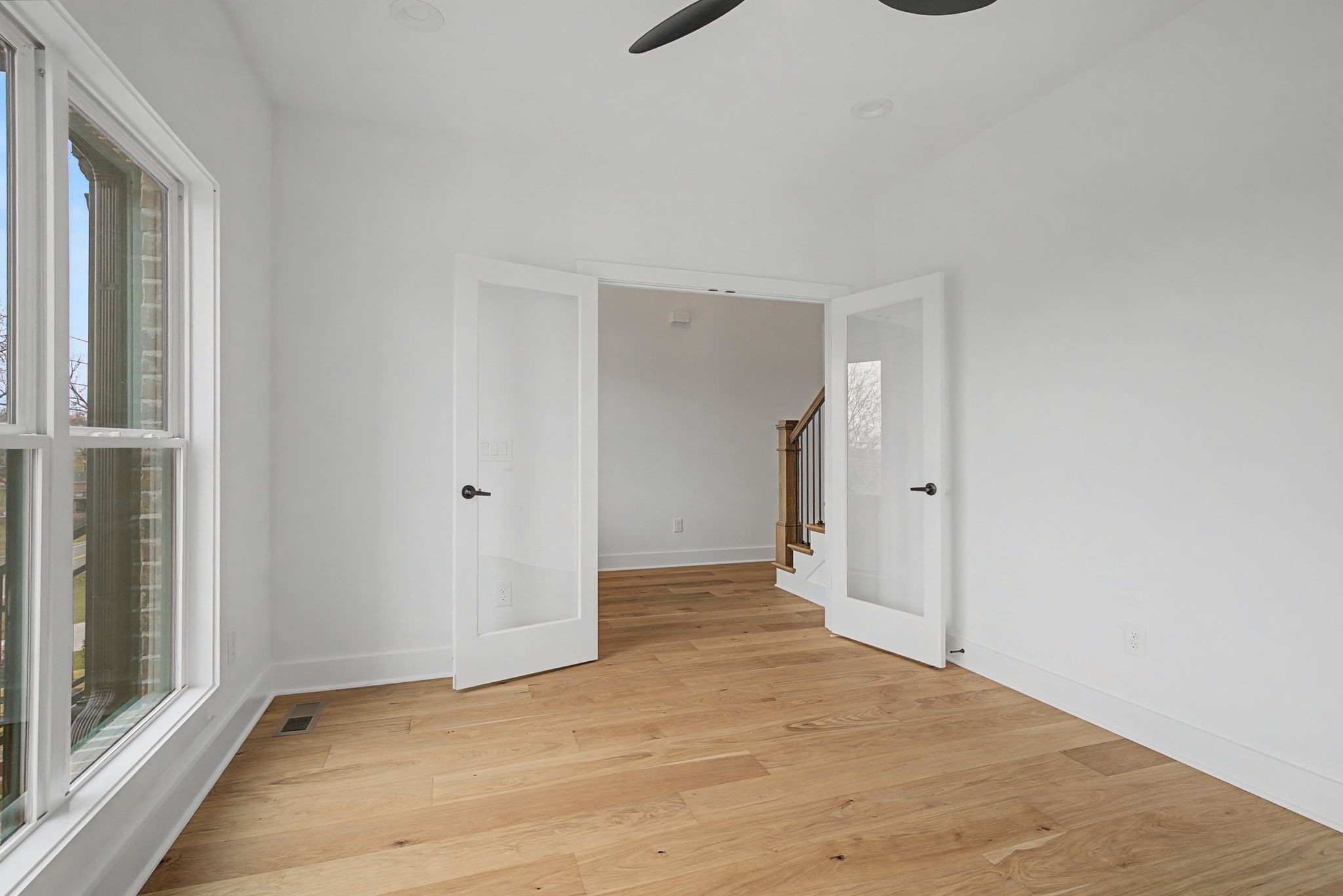 1491 Nonaville Road Mount Juliet, TN 37122 - Photo 16 of 60 a view of an empty room with wooden floor and a window