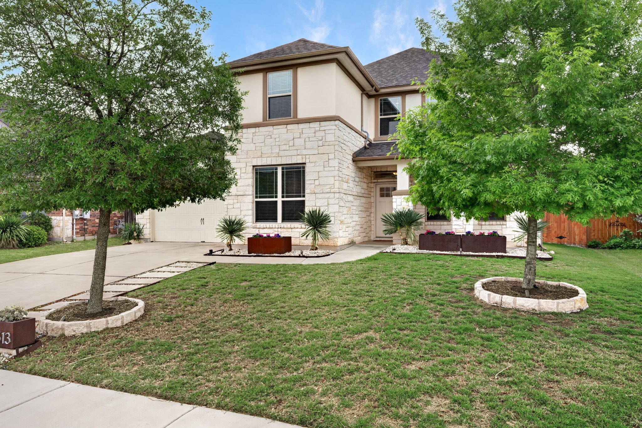 12613 Twisted Root Drive Manchaca, TX 78652 - Photo 2 of 32 a house view with a swimming pool
