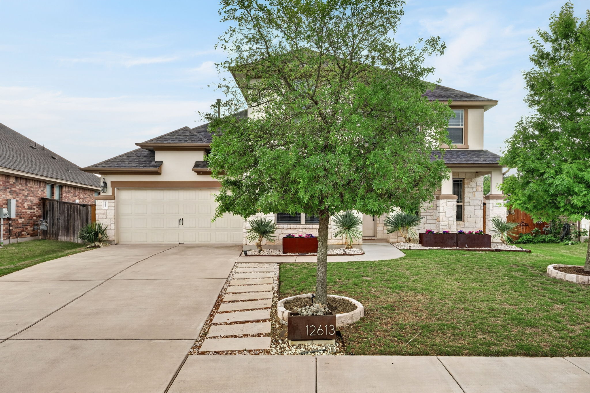 12613 Twisted Root Drive Manchaca, TX 78652 - Photo 25 of 32 a backyard of a house with table and chairs