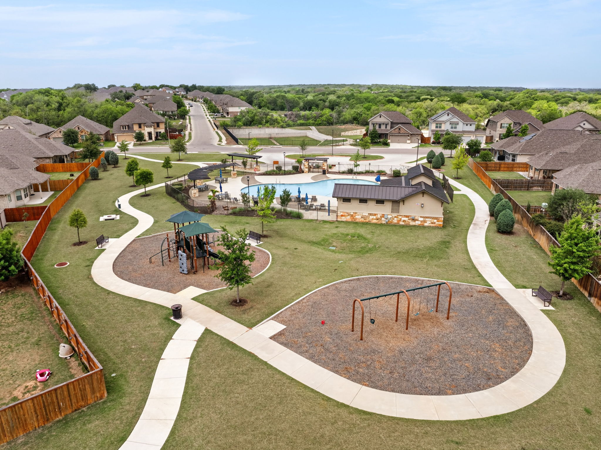 12613 Twisted Root Drive Manchaca, TX 78652 - Photo 26 of 32 an aerial view of a house with a swimming pool outdoor seating and yard