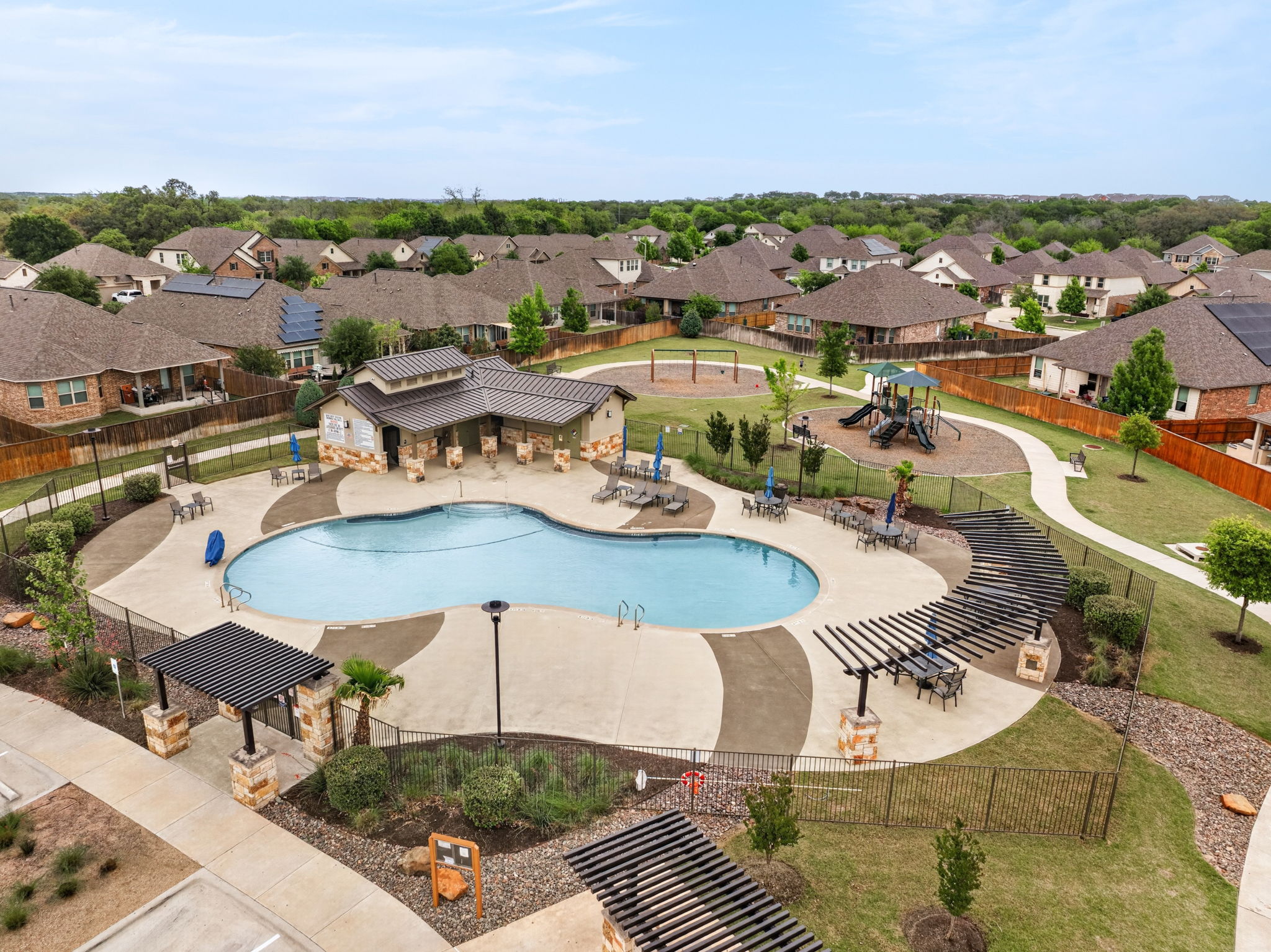 12613 Twisted Root Drive Manchaca, TX 78652 - Photo 28 of 32 an aerial view of a house with swimming pool and ocean view