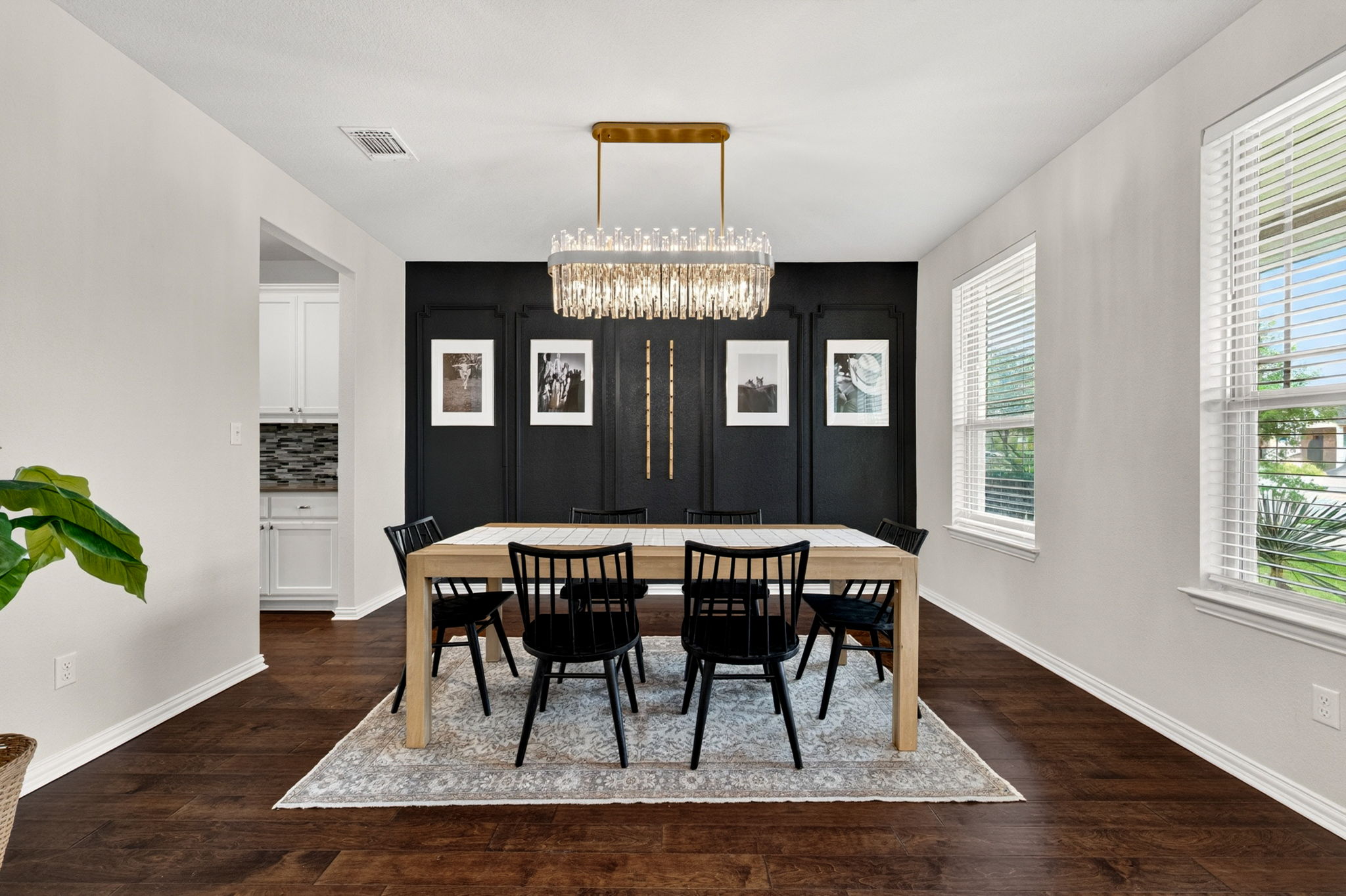 12613 Twisted Root Drive Manchaca, TX 78652 - Photo 3 of 32 a view of a dining room with furniture window and wooden floor
