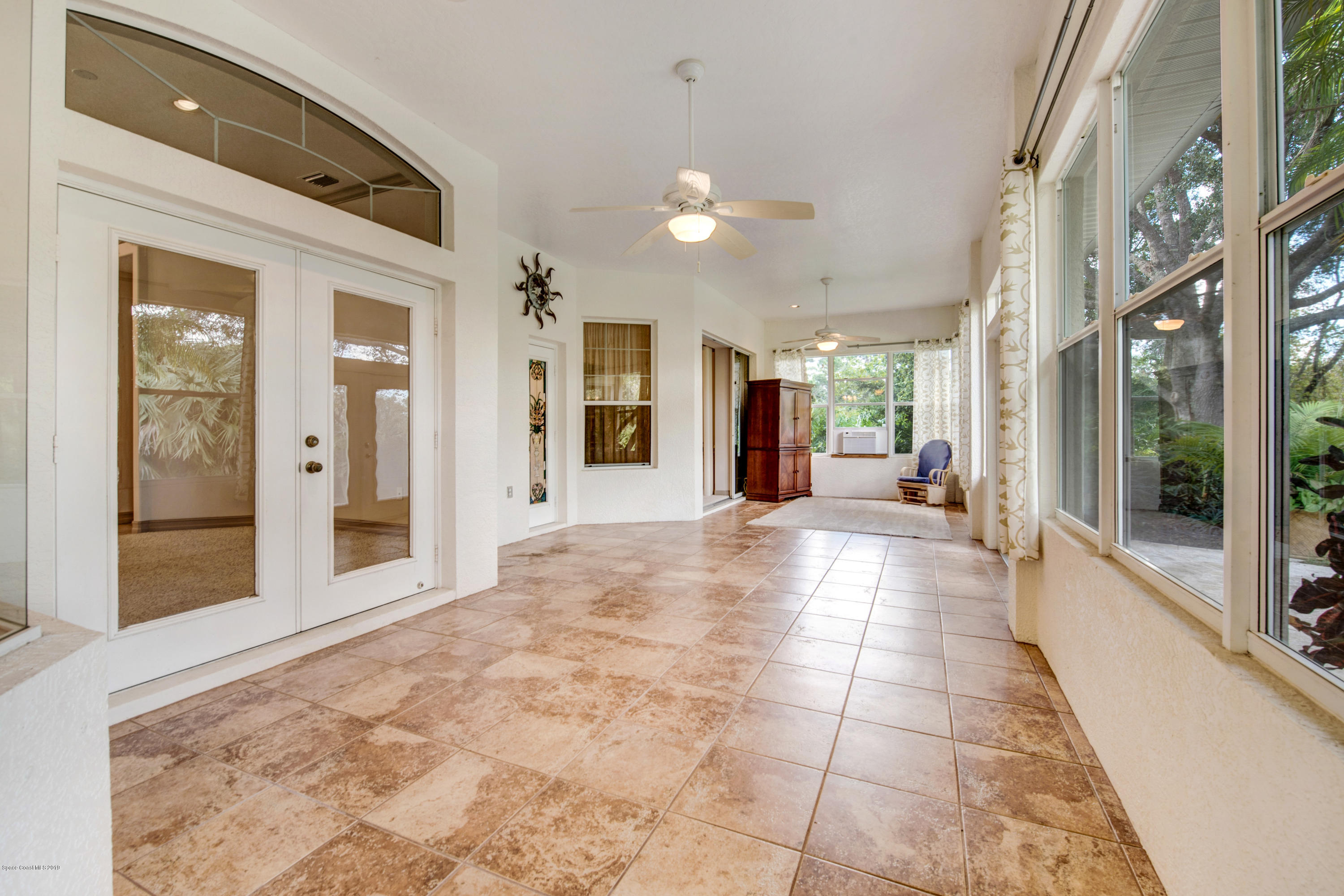 3570 Shady Run Road Melbourne, FL 32934 - Photo 19 of 39 a view of a hallway with a large mirror