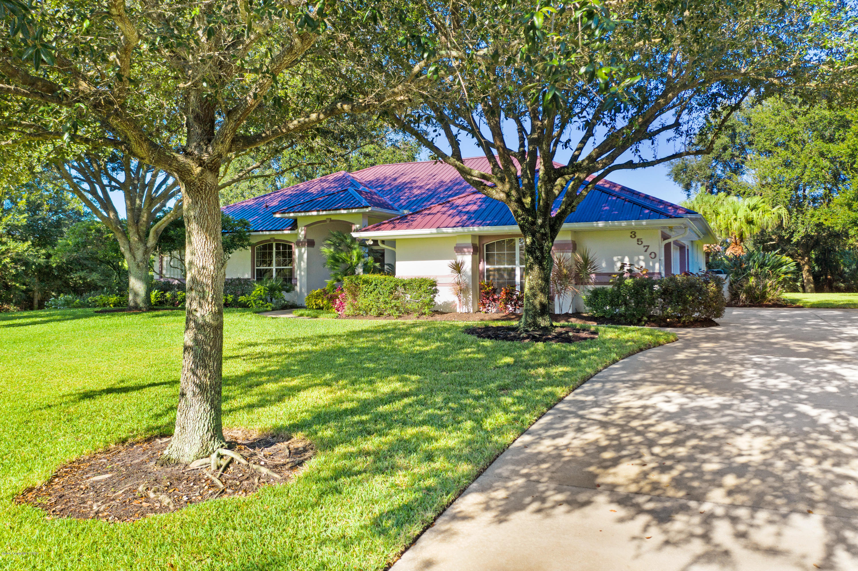 3570 Shady Run Road Melbourne, FL 32934 - Photo 3 of 39 a front view of house with yard