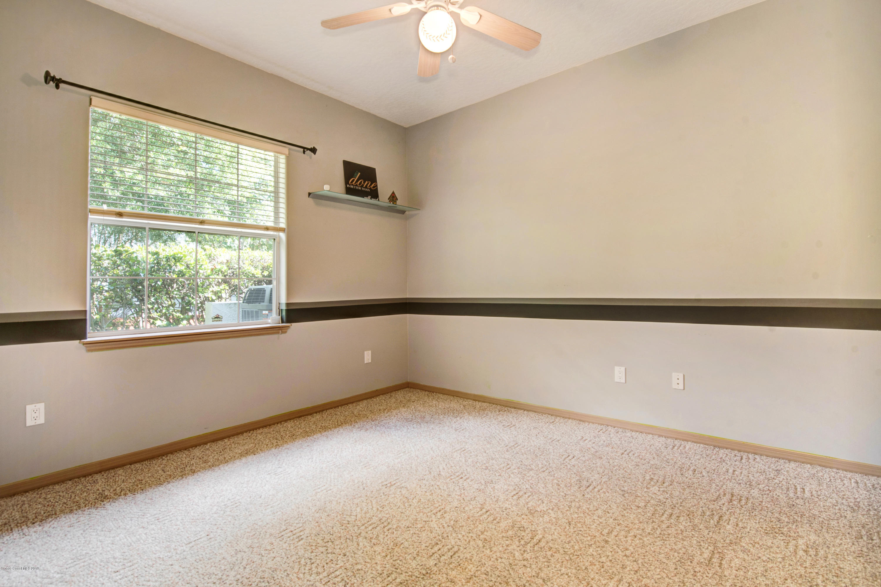 3570 Shady Run Road Melbourne, FL 32934 - Photo 28 of 39 an empty room with a window