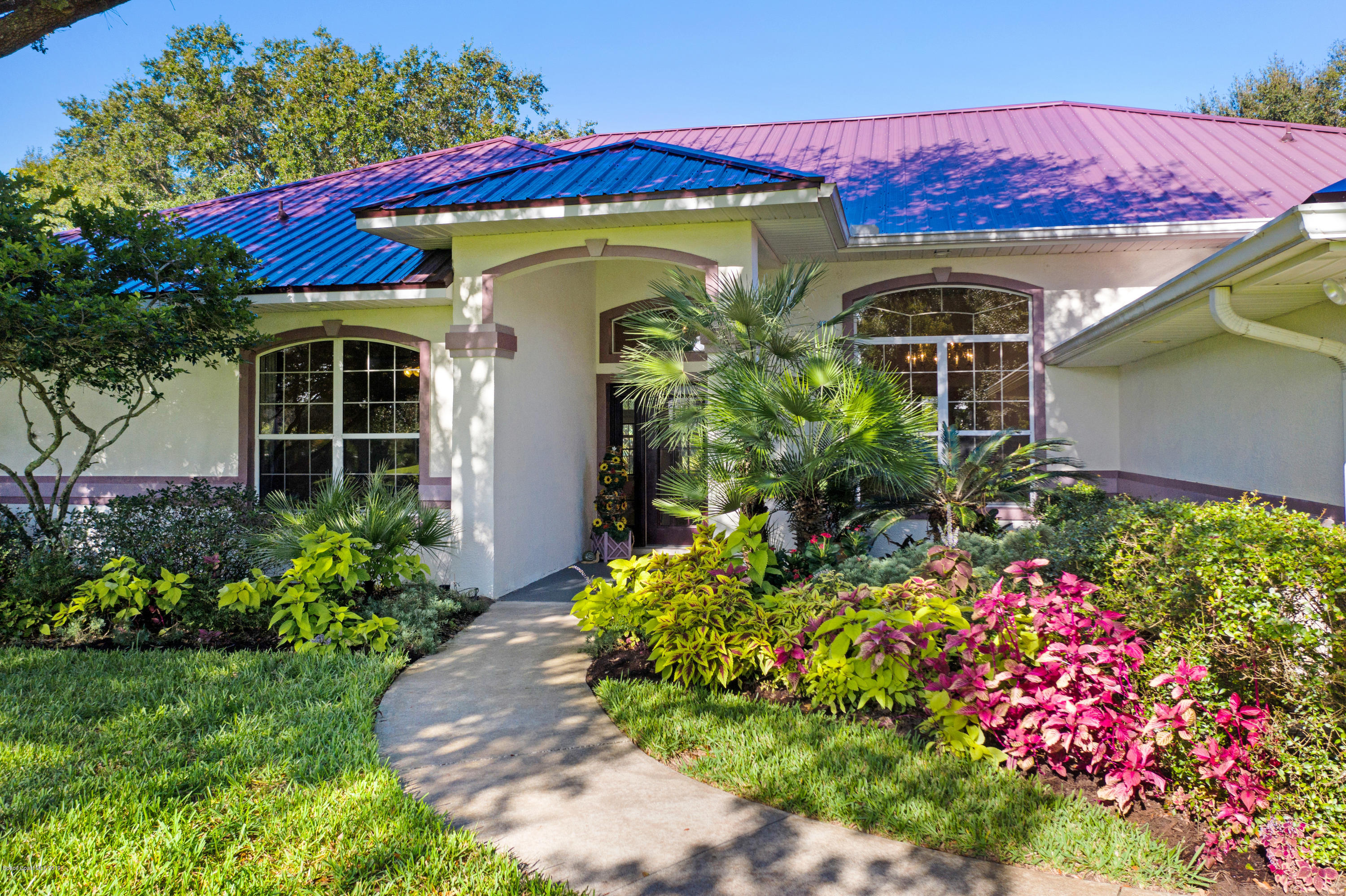 3570 Shady Run Road Melbourne, FL 32934 - Photo 31 of 39 a front view of a house with a yard
