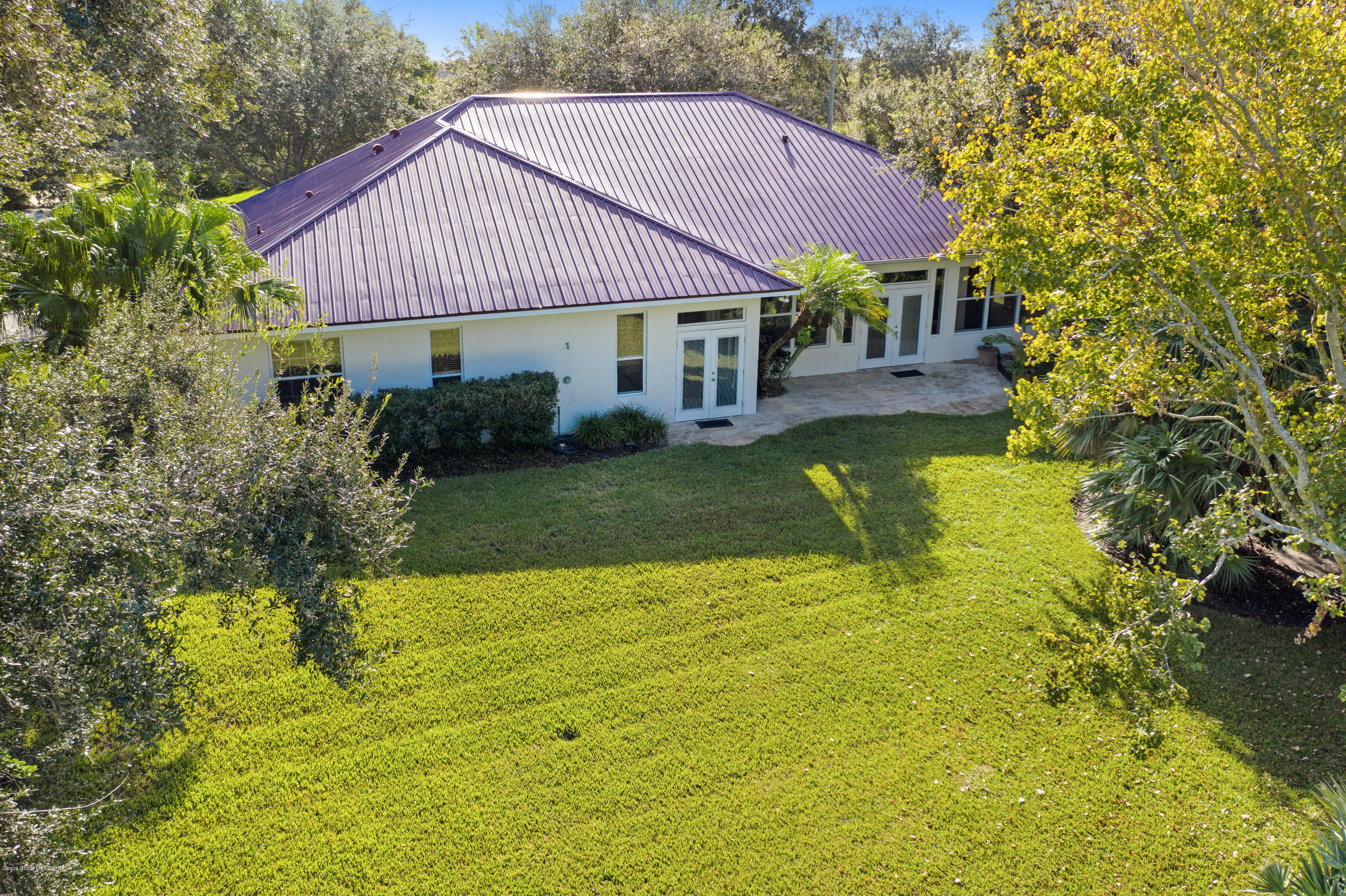 3570 Shady Run Road Melbourne, FL 32934 - Photo 35 of 39 a front view of a house with swimming pool