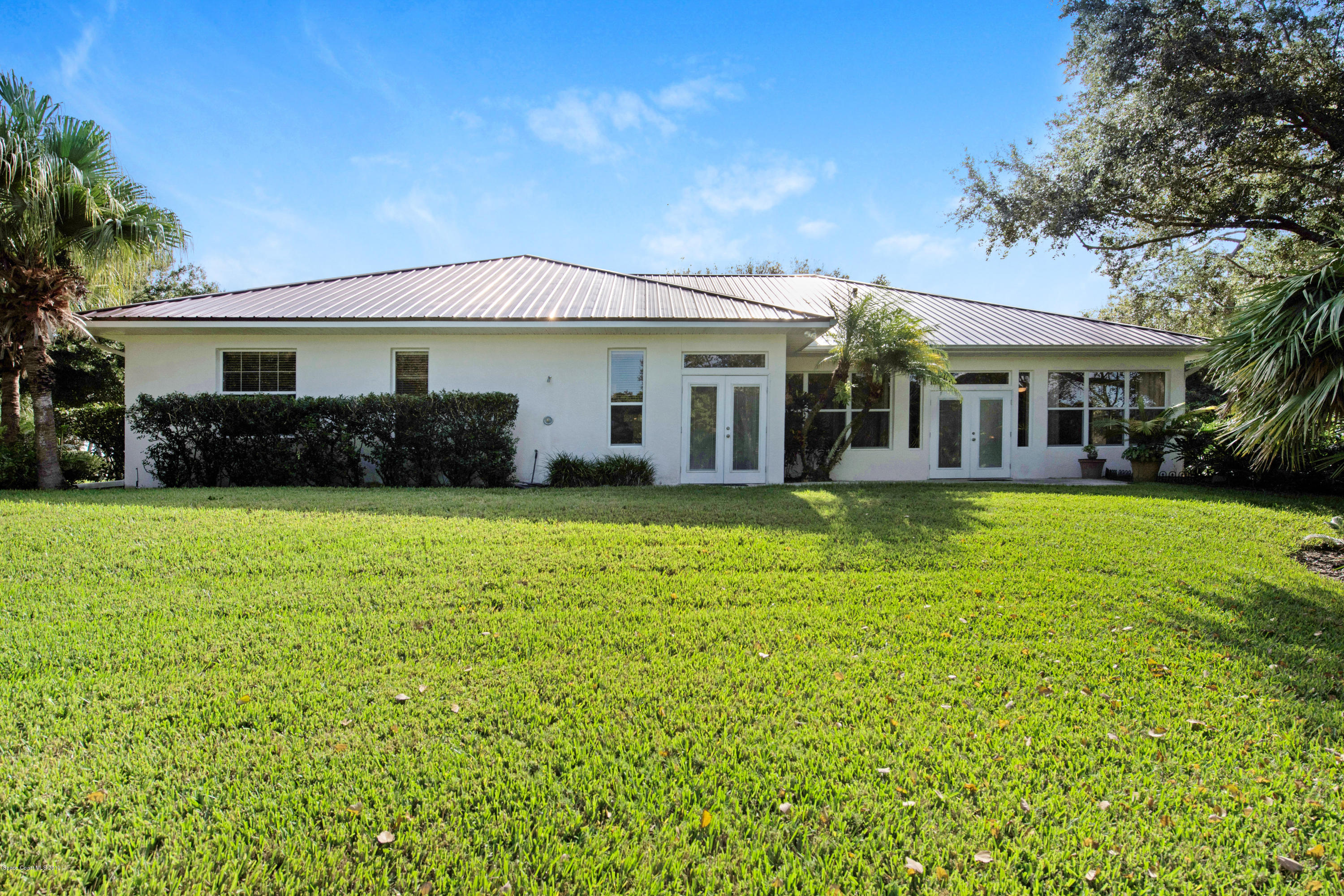 3570 Shady Run Road Melbourne, FL 32934 - Photo 6 of 39 a front view of a house with a yard