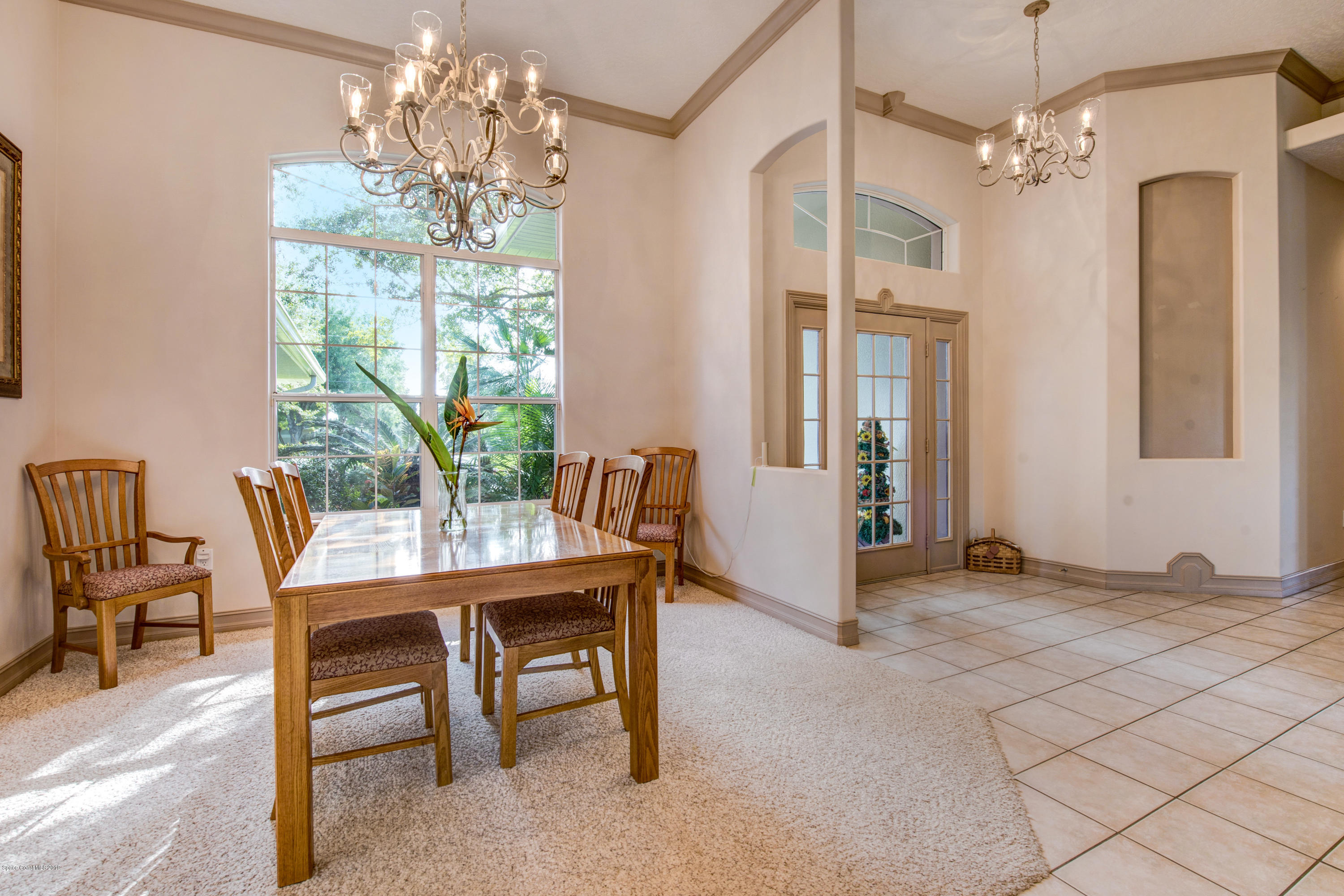 3570 Shady Run Road Melbourne, FL 32934 - Photo 9 of 39 a view of a dining room with furniture window and outside view