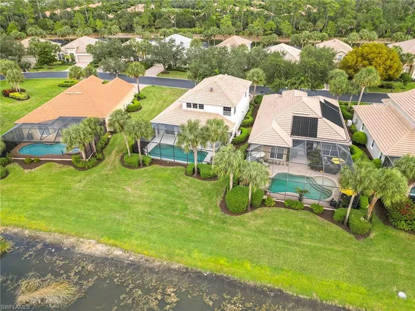 an aerial view of a house with garden space and street view