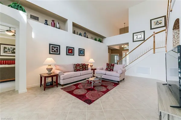a living room with furniture and white walls
