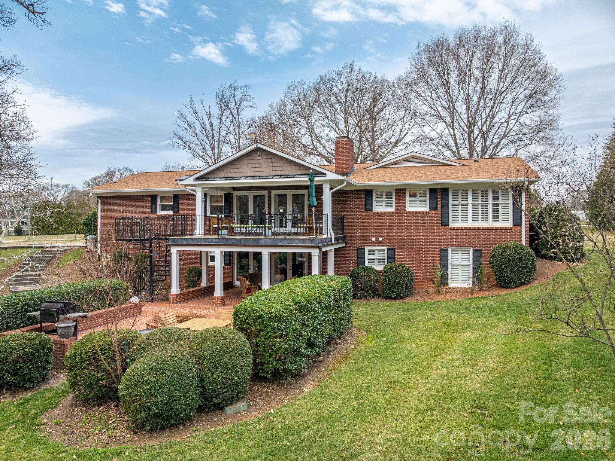 872 Armstrong Road Belmont, NC 28012 - Photo 1 of 48 a front view of a house with a yard