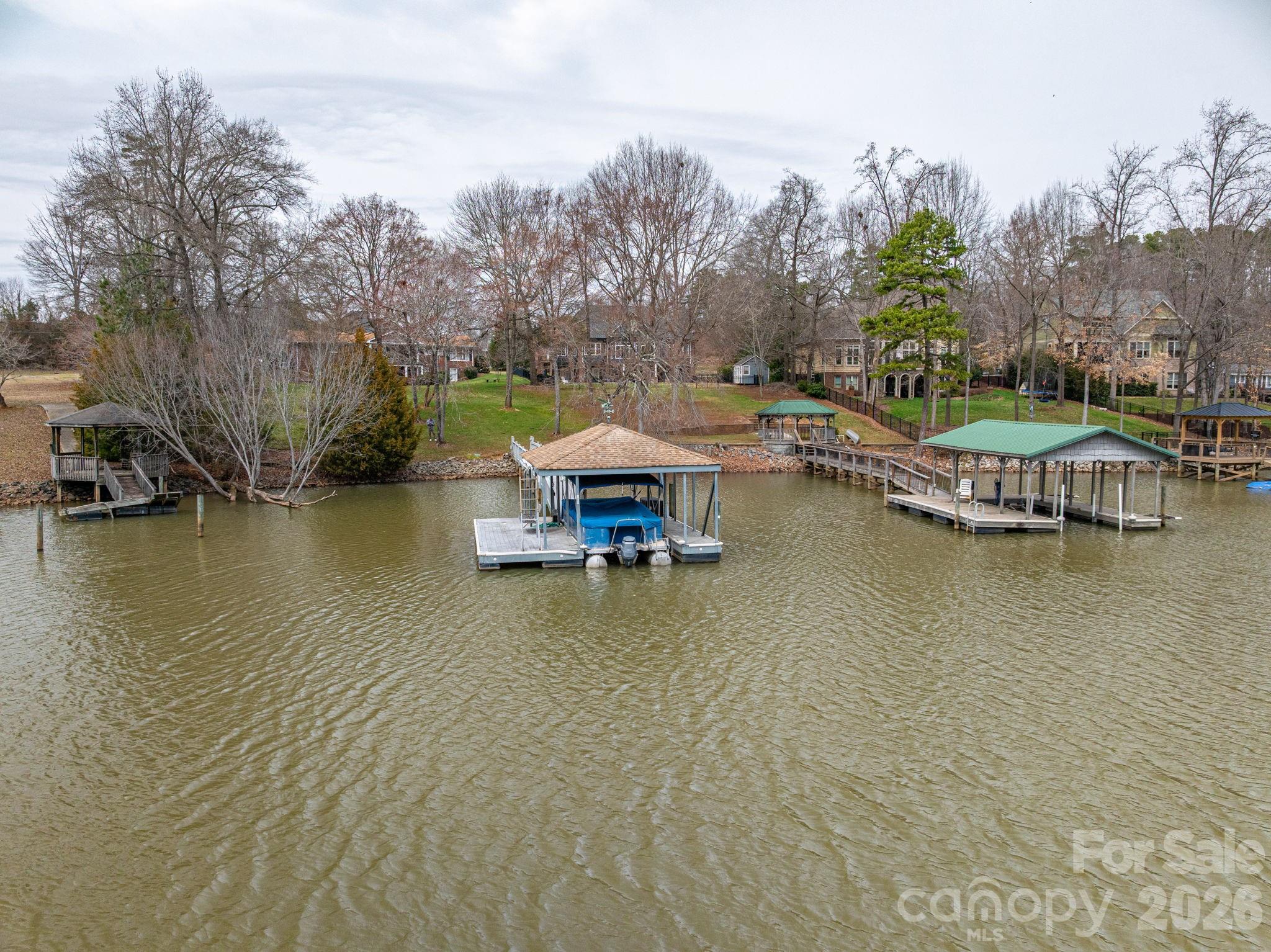 872 Armstrong Road Belmont, NC 28012 - Photo 16 of 48 a view of a lake with houses