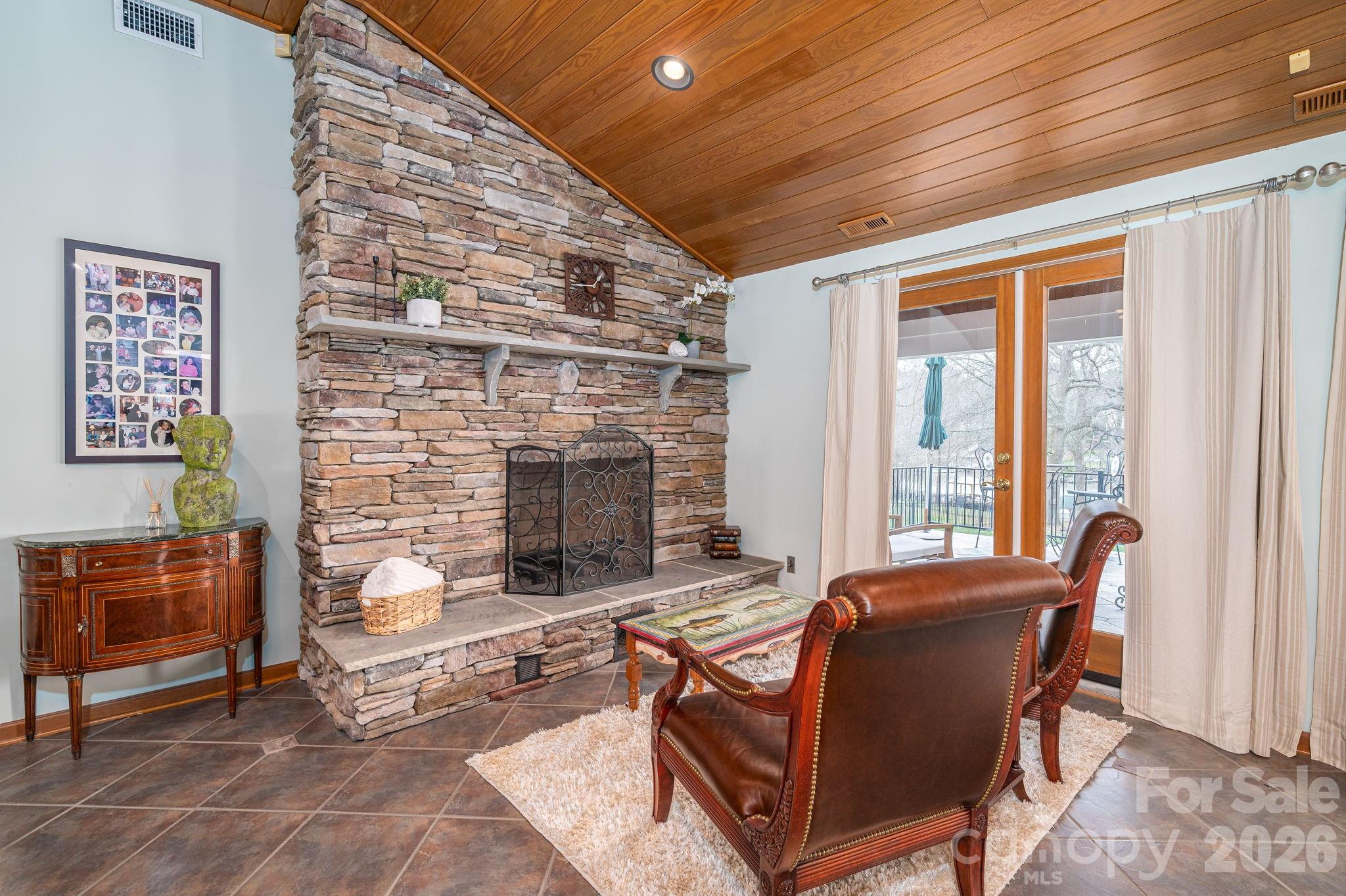 872 Armstrong Road Belmont, NC 28012 - Photo 23 of 48 a living room with furniture and a fireplace