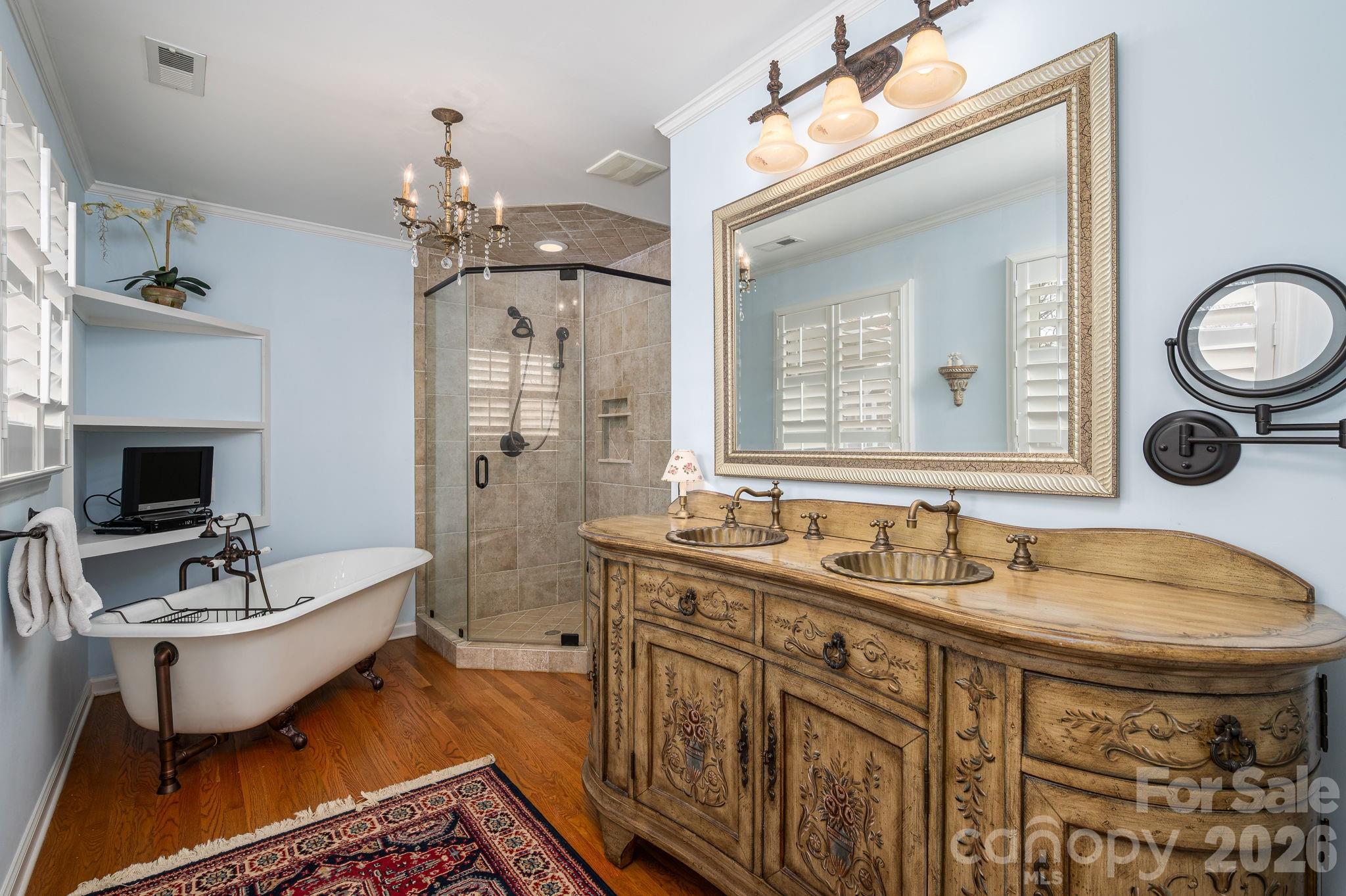 872 Armstrong Road Belmont, NC 28012 - Photo 33 of 48 a bathroom with a double vanity sink mirror and bathtub
