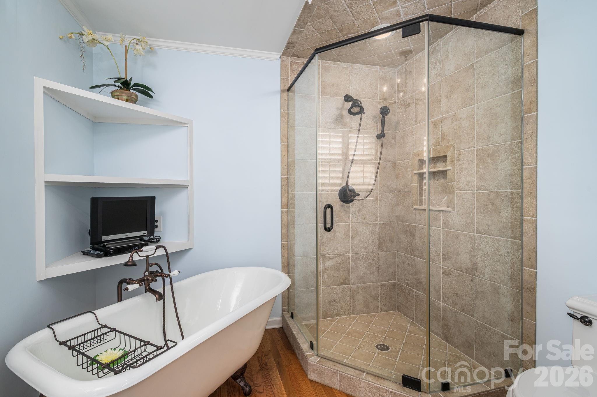 872 Armstrong Road Belmont, NC 28012 - Photo 34 of 48 a bathroom with a sink a mirror and a shower