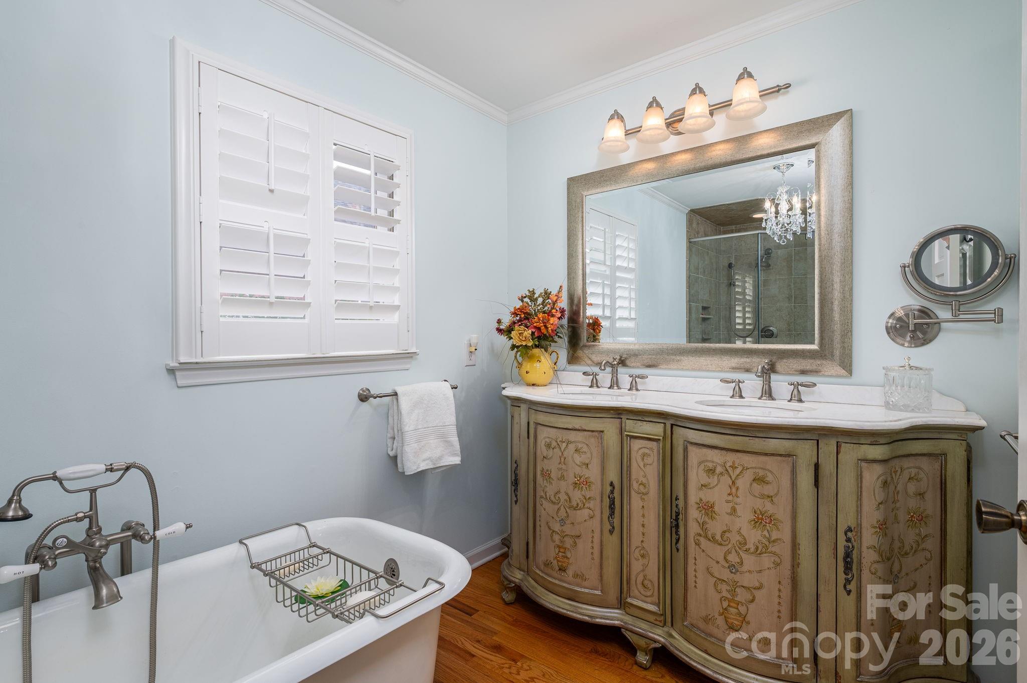872 Armstrong Road Belmont, NC 28012 - Photo 38 of 48 a bathroom with a granite countertop sink a large mirror and a window