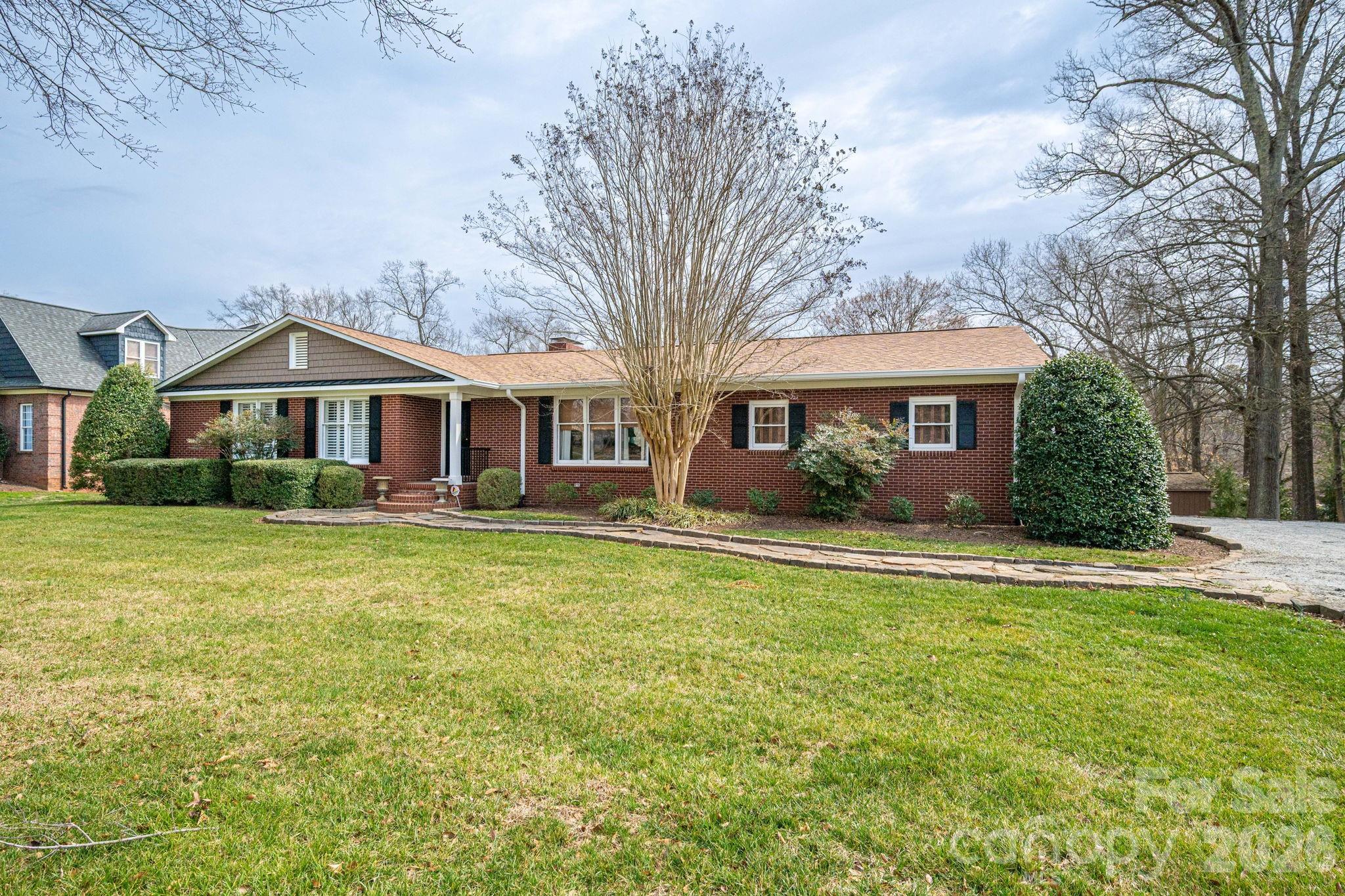 872 Armstrong Road Belmont, NC 28012 - Photo 4 of 48 a front view of a house with a yard