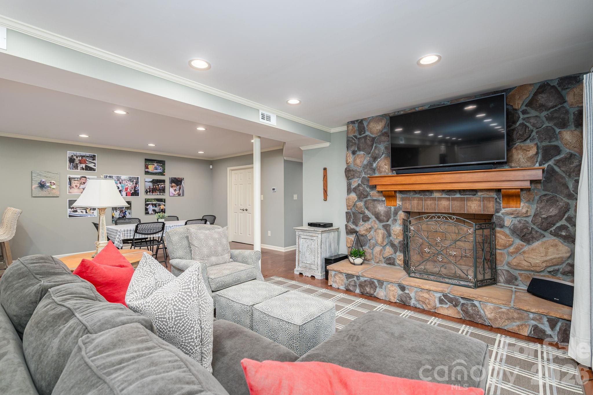 872 Armstrong Road Belmont, NC 28012 - Photo 41 of 48 a living room with furniture and a fireplace