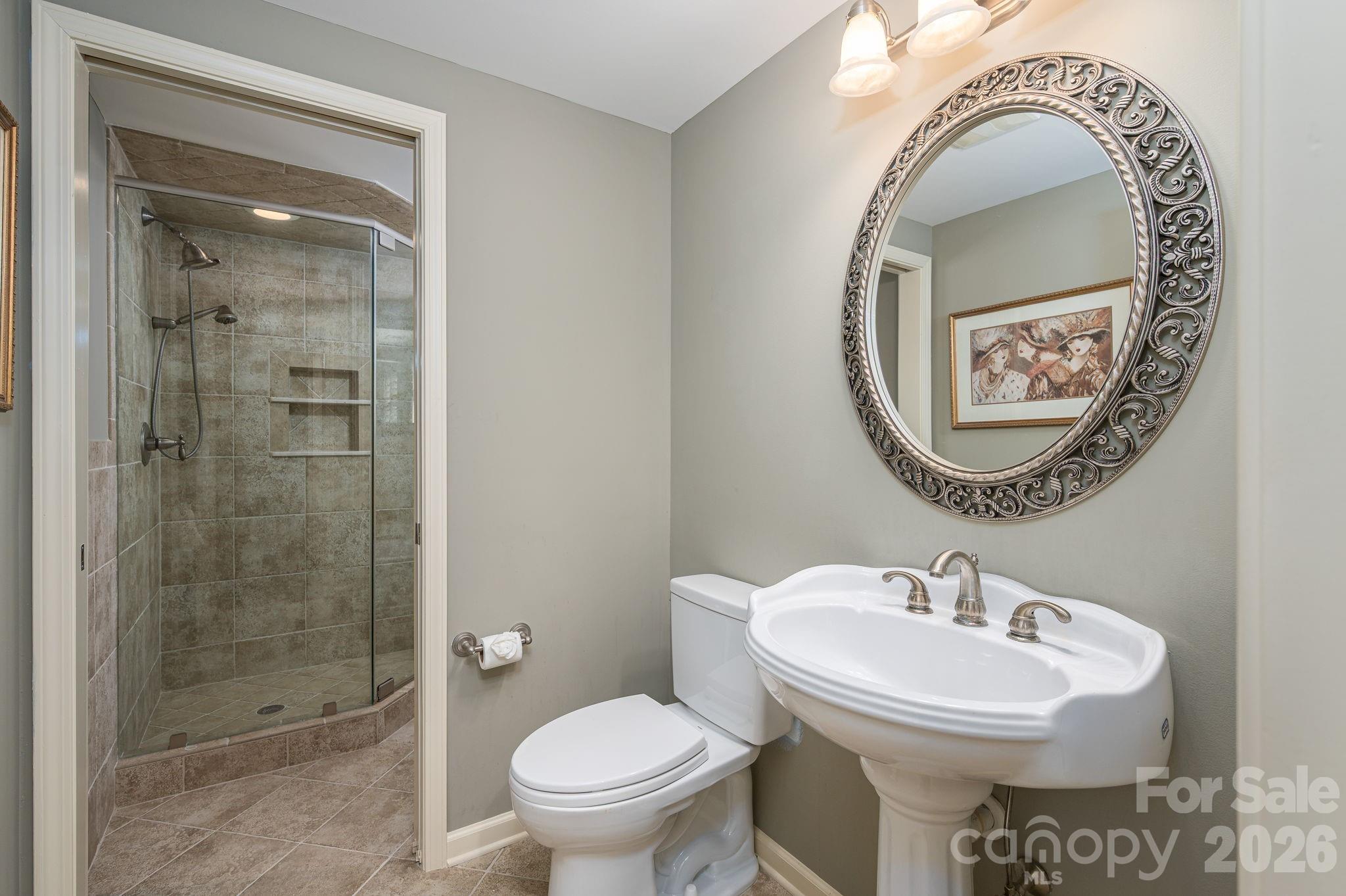 872 Armstrong Road Belmont, NC 28012 - Photo 47 of 48 a bathroom with a toilet sink and shower