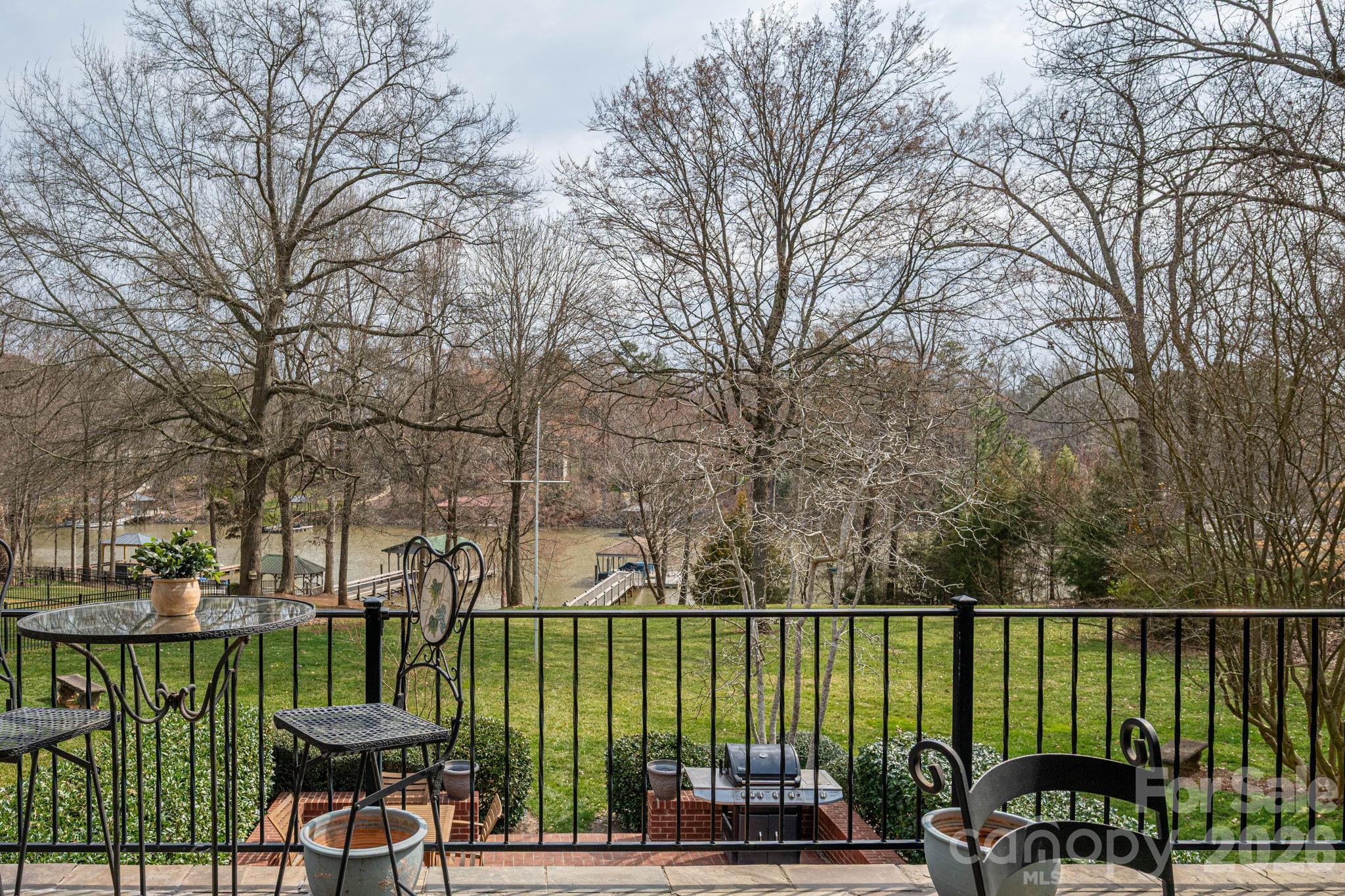 872 Armstrong Road Belmont, NC 28012 - Photo 7 of 48 a view of a lake with a deck