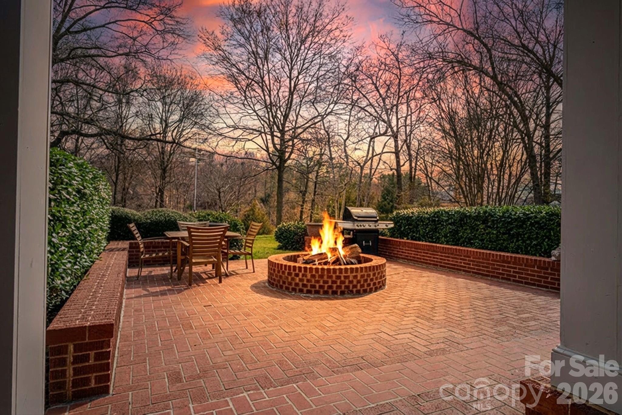 872 Armstrong Road Belmont, NC 28012 - Photo 9 of 48 a backyard of a house with a fountain table and chairs