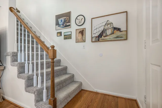 a view of entryway with stairs and wooden floor