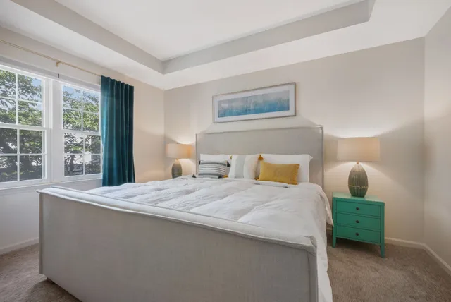 a bedroom with bed and window