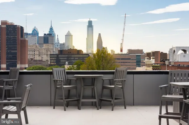 a view of a chairs and table in a terrace